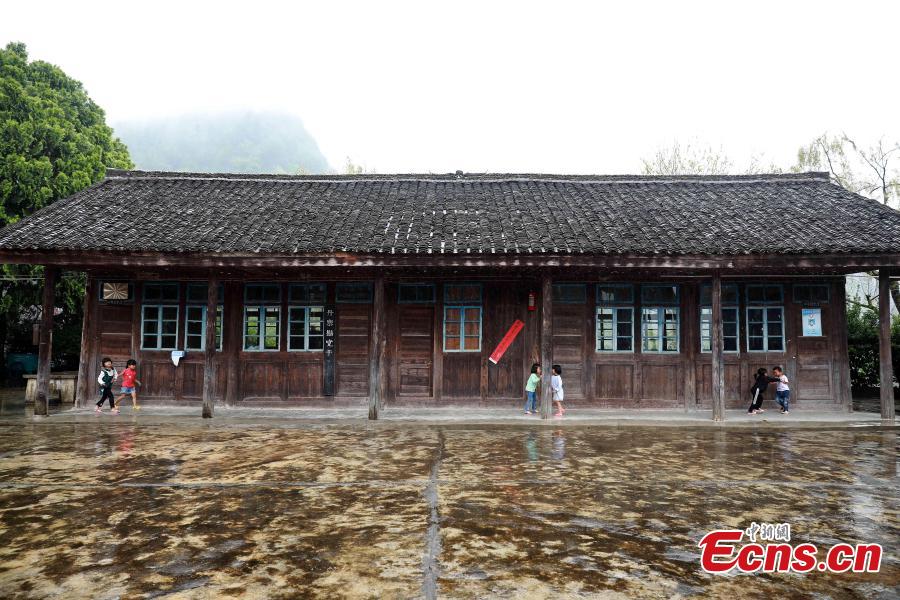 Children play after class at a school in Danggan Village, Paitiao Town, Guizhou Province, Sept. 7, 2018. Yang, 40, is the only teacher in the school that has one first grader and seven pre-school children from nearby villages. If not for the school, children would have to travel to a town more than 20 kilometers away to study. (Photo: China News Service/Huang Xiaohai)