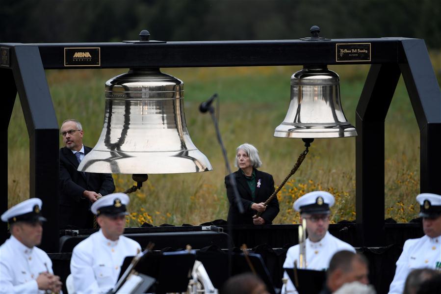 People ring the bells to commemorate the victims of the Flight 93, marking the 17th anniversary of the Sept. 11 attacks, at the Flight 93 National Memorial, in Shanksville, Pennsylvania, the United States, Sept. 11, 2018. (Photo/Xinhua)