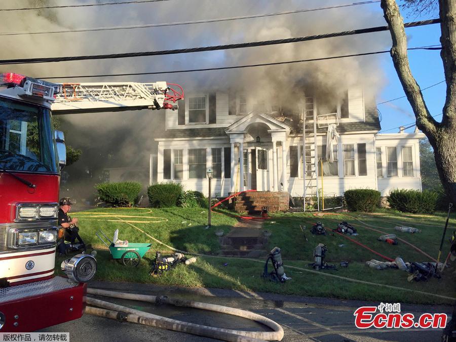 Firefighters battle a house fire, Thursday, Sept. 13, 2018, on Herrick Road in North Andover, Mass., one of multiple emergency crews responding to a series of gas explosions and fires triggered by a problem with a gas line that feeds homes in several communities north of Boston. (Photo/Agencies)