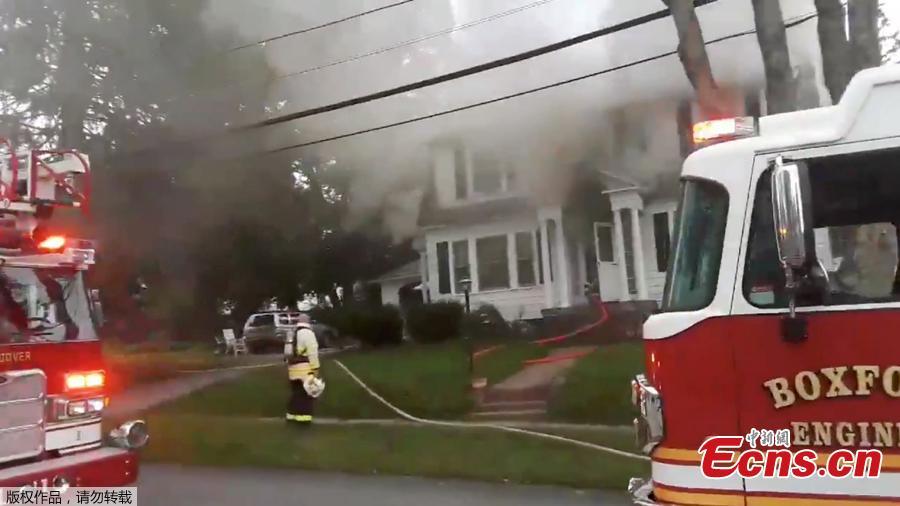 Firefighters work near a building emitting smoke after explosions in North Andover, Massachusetts, United States in this September 13, 2018 still image from social media video footage by Boston Sparks. (Photo/Agencies)