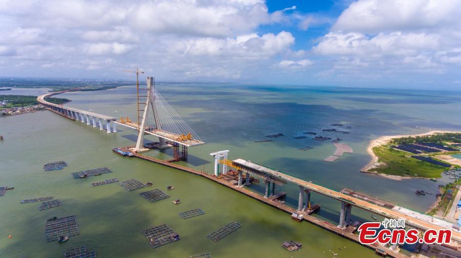 A view of the Puqian Bridge under construction in South China\'s Hainan Province, Sept. 14, 2018. Construction of the cross-sea bridge, scheduled for completion at the end of 2018, will cut the trip from Wenchang City to Haikou City from 90 minutes to about 20 minutes. Spanning a geological fault line, it’s being built to the highest standard of earthquake resistance at an investment of 3.01 billion yuan ($440 million). The 5.6-km-long bridge is expected to promote economic growth in the northern part of Hainan Province. (Photo: China News Service/Luo Yunfei)