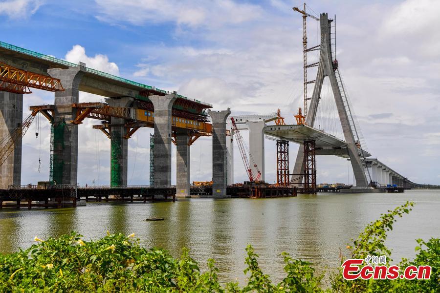 A view of the Puqian Bridge under construction in South China\'s Hainan Province, Sept. 14, 2018. Construction of the cross-sea bridge, scheduled for completion at the end of 2018, will cut the trip from Wenchang City to Haikou City from 90 minutes to about 20 minutes. Spanning a geological fault line, it’s being built to the highest standard of earthquake resistance at an investment of 3.01 billion yuan ($440 million). The 5.6-km-long bridge is expected to promote economic growth in the northern part of Hainan Province. (Photo: China News Service/Luo Yunfei)
