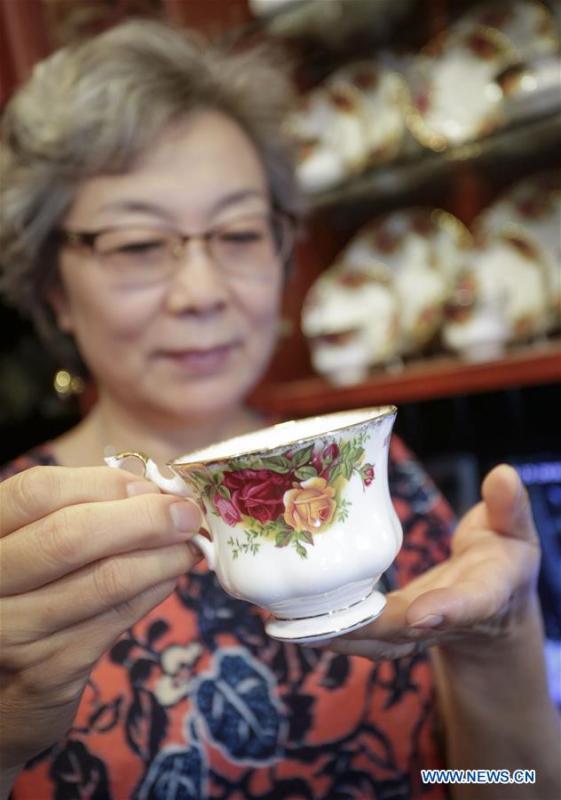 Teacup collector June Gao displays one of her teacup collections at her house in Vancouver, Canada, Sept. 13, 2018. (Xinhua/Liang Sen)