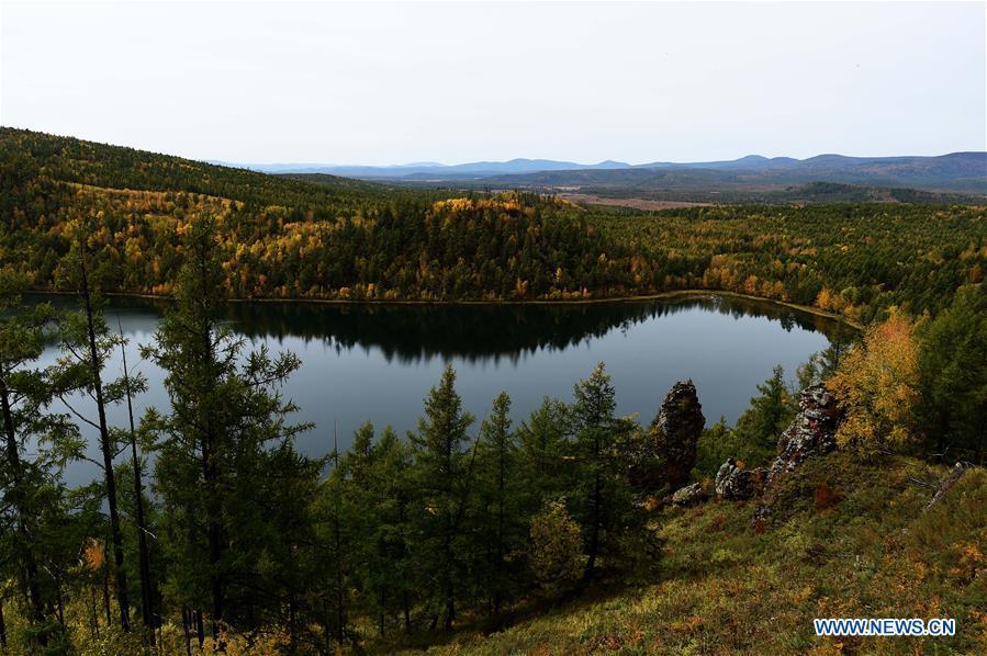 Photo taken on Sept. 14, 2018 shows autumn scenery of the Tianchi Lake in Arxan, north China\'s Inner Mongolia Autonomous Region. (Xinhua/Ren Junchuan)