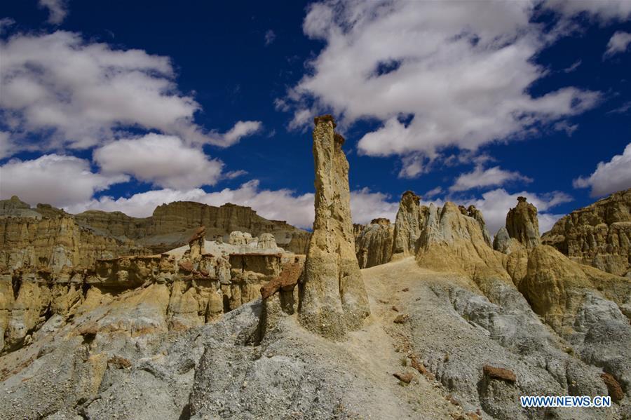 Photo taken on Sept. 11, 2018 shows the scenery of Xiayigou Earth Forest in Zanda County of Ali, southwest China\'s Tibet Autonomous Region. Settled along the Xiangquan River in the county, the well-preserved Earth Forest appears colorful especially under direct sunlight due to the ore contained. (Xinhua/Purbu Zhaxi)