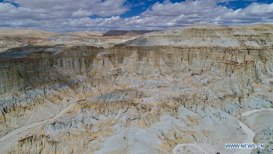 Aerial photo taken on Sept. 11, 2018 shows the scenery of Xiayigou Earth Forest in Zanda County of Ali, southwest China\'s Tibet Autonomous Region. Settled along the Xiangquan River in the county, the well-preserved Earth Forest appears colorful especially under direct sunlight due to the ore contained. (Xinhua/Purbu Zhaxi)