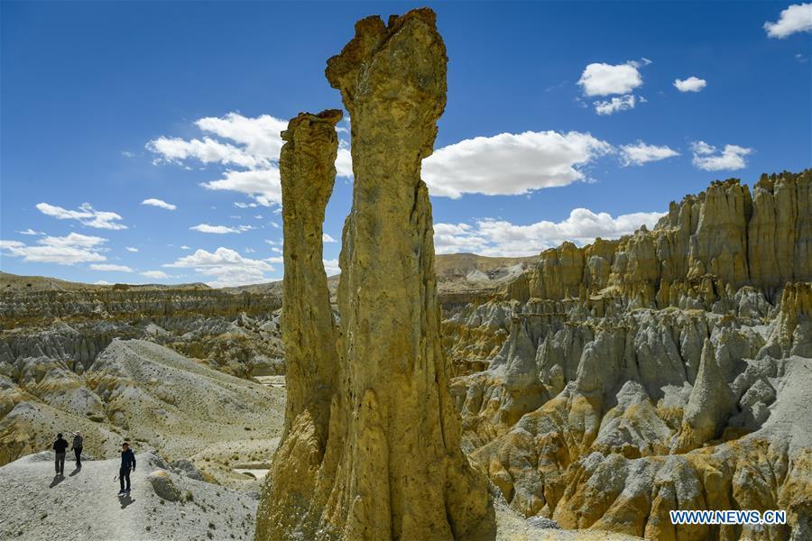 Photo taken on Sept. 14, 2018 shows the scenery of Xiayigou Earth Forest in Zanda County of Ali, southwest China\'s Tibet Autonomous Region. Settled along the Xiangquan River in the county, the well-preserved Earth Forest appears colorful especially under direct sunlight due to the ore contained. (Xinhua/Liu Dongjun)