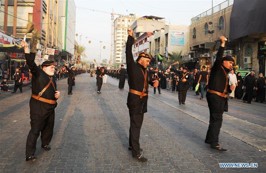 People participate in the celebration of upcoming Ashura in Baghdad, Iraq, Sept. 19, 2018. Ashura, the 10th day of the Islamic month of Muharram, marks the martyrdom of Imam Hussein, the grandson of Prophet Mohammad, in the battle of Kerbala in Iraq in the year 680. (Xinhua/Khalil Dawood)