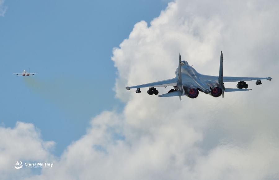 Two J-11B fighter jets attached to an aviation brigade of the South China Sea Fleet under the PLA Navy take off for a sortie during a live-fire flight training exercise near the South China Sea on September 19, 2018. (Photo/eng.chinamil.com.cn)