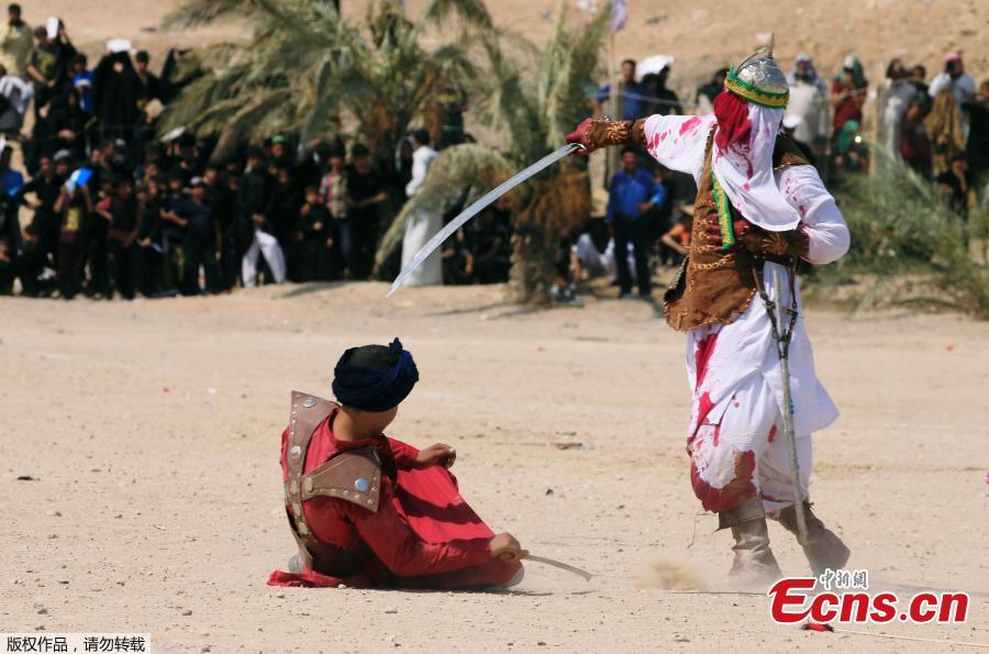 Local actors dressed as ancient warriors re-enact a scene from the 7th century battle of Karbala to commemorate Ashura in Najaf, Sept. 20, 2018. (Photo/Agencies)