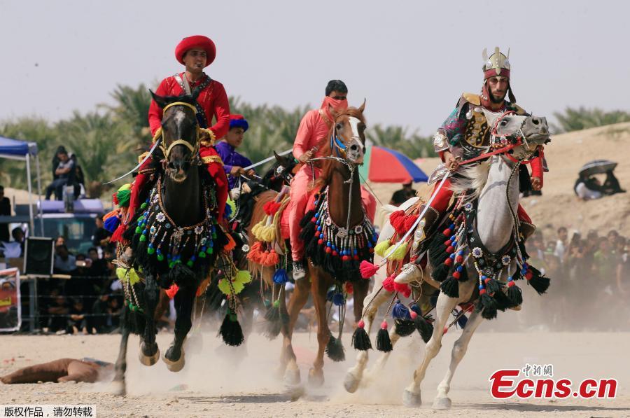 Local actors ride horses and dressed as ancient warriors re-enact a scene from the 7th century battle of Karbala to commemorate Ashura in Najaf, Sept. 20, 2018. (Photo/Agencies)