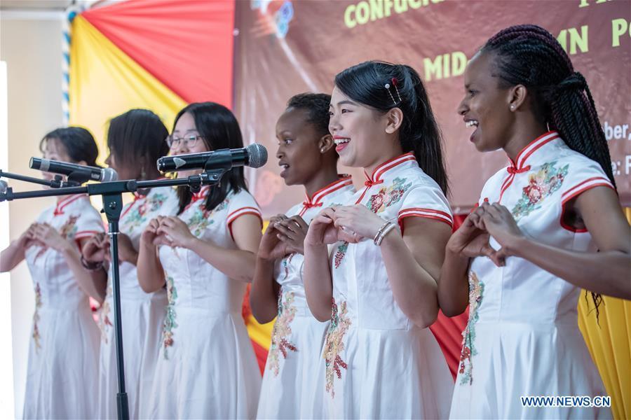 Chinese volunteers and students of the Confucius Institute of Kenyatta University sing a Chinese song at Kenyatta University in Nairobi, Kenya, on Sept. 21, 2018. The Confucius Institute of University of Nairobi and the Confucius Institute of Kenyatta University held celebrations respectively on Friday to mark the upcoming Mid-Autumn Festival, which falls on Sept. 24 this year. (Xinhua/Zhang Yu)