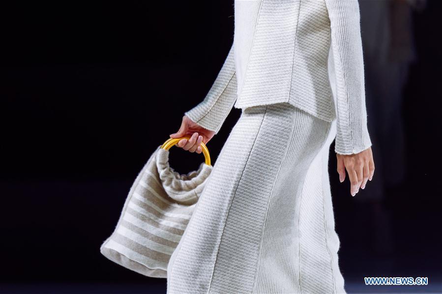 A model presents a creation at the 2018 Beijing Fashion Week in Beijing, capital of China, Sept. 22, 2018. The eight-day fashion week closed here on Saturday. (Xinhua/Liu Jinhai)