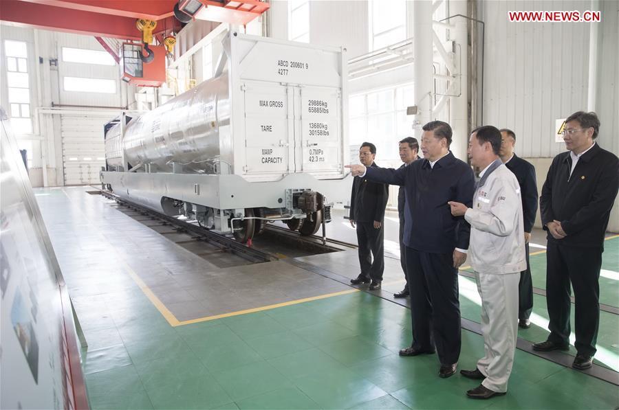 Chinese President Xi Jinping, also general secretary of the Communist Party of China (CPC) Central Committee and chairman of the Central Military Commission, visits a research center of China Railway Rolling Stock Corporation (CRRC) Qiqihar Co. in Qiqihar, northeast China\'s Heilongjiang Province, Sept. 26, 2018. Xi inspected Qiqihar on Wednesday. (Xinhua/Wang Ye)