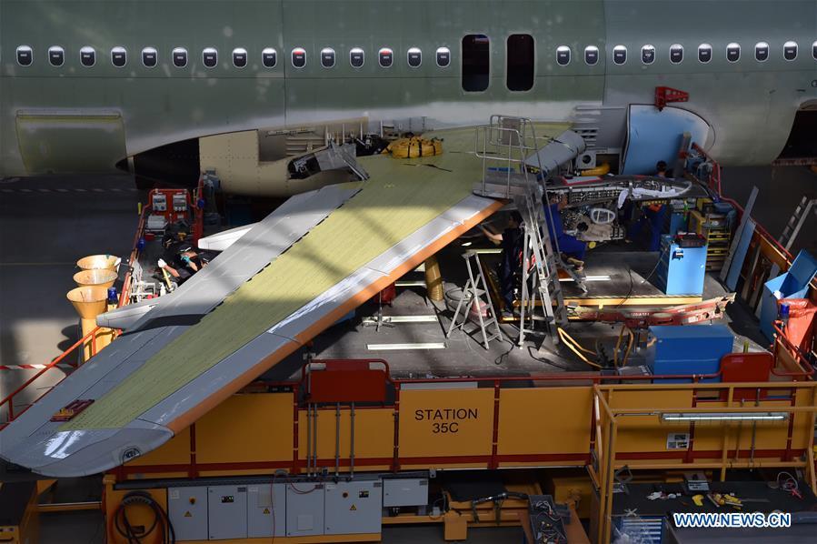 Staff members work at Airbus\' Tianjin final assembly line for the A320-family of jets in north China\'s Tianjin, Sept. 27, 2018. From the time it was established in 2008 until the end of this August, the Tianjin final assembly line assembled and delivered a total of 378 A320s. (Xinhua/Li Ran)