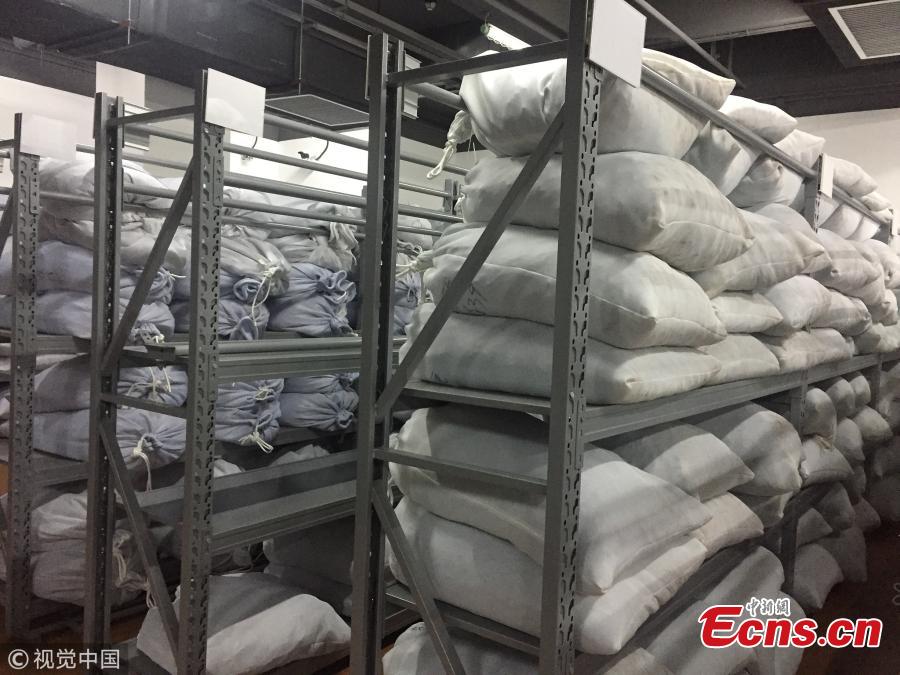 Photo taken on Sept. 26, 2018 shows a Guangzhou Customs press conference to announce a major success in busting the smuggling of endangered animals and plants, the largest case in the city. From July to August, Guangzhou Customs seized 7.26 tons of pangolin scales, which means about 120,000 to 180,000 pangolins were slaughtered. The scales sold for 340 yuan ($49) per kilogram in Africa and 5,600 yuan per kilogram in China. (Photo/VCG)