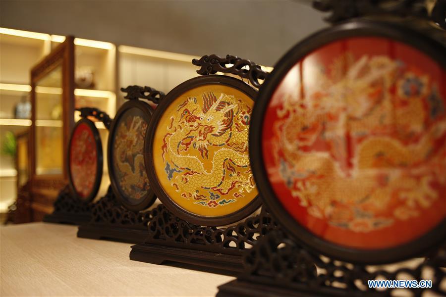 Photo taken on Sept. 26, 2018 shows Yun brocade products at the Nanjing Yunjin Museum in Nanjing, capital of east China\'s Jiangsu Province. Yunjin, also called Yun brocade, is traditional Chinese silk brocade made in Nanjing of Jiangsu. Dated from the Eastern Jin Dynasty, it has formed its own characteristics through its development of 1,600 years. Yun brocade is famous for its exquisite craft, elegant patterns and smooth texture, and the making of the artwork requires close cooperation of two weavers, who can produce only five centimeters a day. In 2009, Yun brocade was inscribed on the Representative List of the Intangible Cultural Heritage of Humanity. (Xinhua/Zhu Weixi)