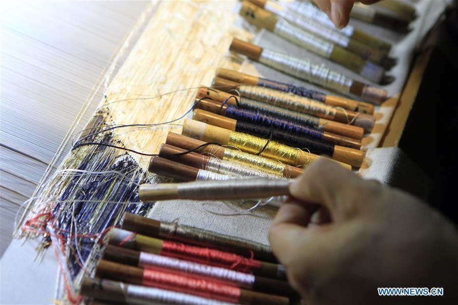 Photo taken on Sept.26, 2018 shows colorful silk threads used for weaving Yun brocade at the Nanjing Yunjin Museum in Nanjing, capital of east China\'s Jiangsu Province. Yunjin, also called Yun brocade, is traditional Chinese silk brocade made in Nanjing of Jiangsu. Dated from the Eastern Jin Dynasty, it has formed its own characteristics through its development of 1,600 years. Yun brocade is famous for its exquisite craft, elegant patterns and smooth texture, and the making of the artwork requires close cooperation of two weavers, who can produce only five centimeters a day. In 2009, Yun brocade was inscribed on the Representative List of the Intangible Cultural Heritage of Humanity. (Xinhua/Sui Xiankai)