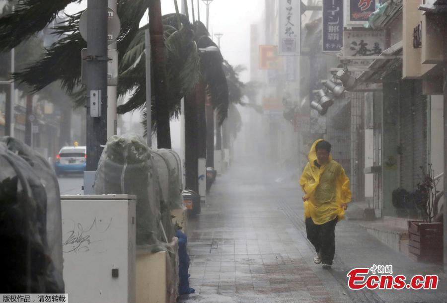 A person walks in the street during strong rain and wind in Naha, Okinawa Prefecture, Sept. 29, 2018, as typhoon Trami approaches Japan\'s southernmost prefecture. (Photo/Agencies)