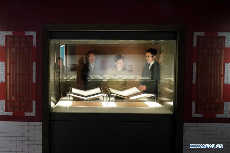Visitors view exhibits during an exhibition on Yongle Encyclopaedia at National Library of China in Beijing, capital of China, Sept. 28, 2018. Yongle Encyclopaedia is China\'s first encyclopaedia compiled in the Ming Dynasty (1368-1644). The exhibition kicked off here on Friday. (Xinhua/Yin Gang)