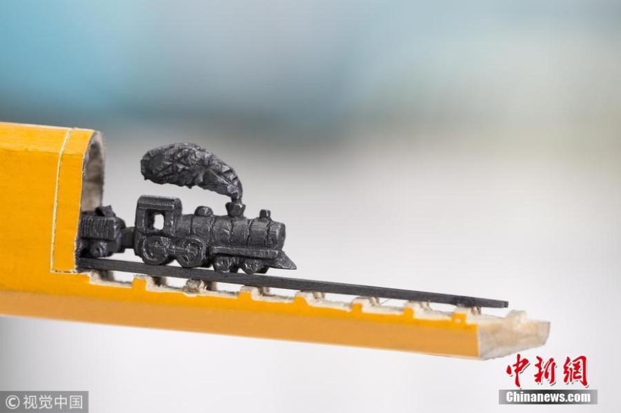 A artwork carved from the tip of pencil lead, by Turkish artist Nihat Ozcan. Ozcan is one of the rare pencil carving artists in the world. He carves figures in miniature on the tips of pencils. (Photo/CFP)