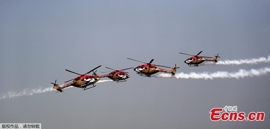 Advanced Light Helicopters (ALH) from the Indian Air Force\'s Sarang aerobatics team perform during the Air Force Day parade at the Air Force station Hindon in Ghaziabad town on the outskirts of New Delhi on October 8, 2018. The Indian Air Force celebrated its 86th anniversary on October 8, 2018. (Photo/Agencies)
