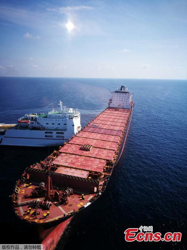 A Tunisian tanker carrying trucks rams into an anchored Cypriot container ship north of Corsica, Oct. 7, 2018. French and Italian boats are racing to contain a 12-mile fuel spill which was been spreading since the crash.(Photo/Agencies)