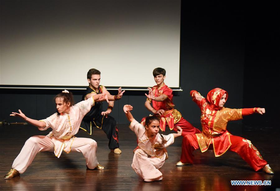 Members of the Turkish Kung Fu national team perform in Bogazici University of Istanbul, Turkey, on Oct. 9, 2018. A charm of Chinese Kung Fu tour started on Tuesday evening at Bogazici University in Istanbul, enchanting the audience with a mixture of Chinese martial arts and dances. (Xinhua/He Canling)