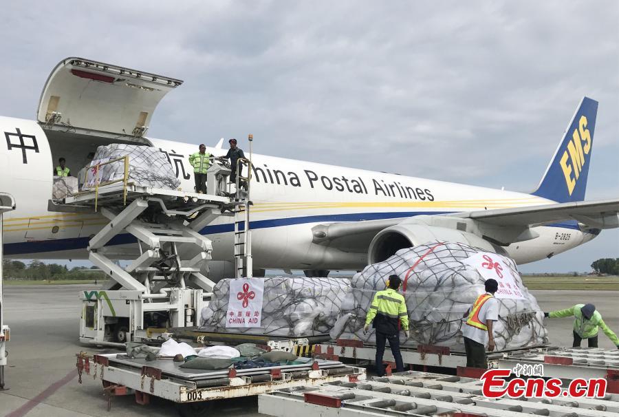 The first batch of humanitarian supplies from the Chinese government for Indonesia\'s quake victims arrives at Balikpapan International Airport in eastern Kalimantan Island, Indonesia, on Oct. 9, 2018. The aid, consisting of tents, water treatment equipment, generators and other supplies, will be delivered to the earthquake and tsunami-hit areas in Central Sulawesi province soon. There are still four batches of this kind of aid to be delivered in days. (Photo provided to China News Service)