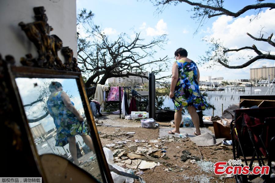 Teresa Sheffield walks out of the remains of her second floor apartment in the aftermath of Hurricane Michael October 11, 2018 in Panama City, Florida. (Photo/Agencies)