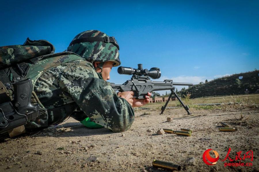 A 40-day long sniper training was recently held by a unit of Chinese armed police force in central China\'s Henan to hone the special operation force known as the Ghost Busters. (Photo/people.cn)
Nearly 100 elite special ops and scouts participated in the training that adopted experience and advanced concepts found in special operations both at home and abroad and worked through a total 37 items in seven categories including theory learning, mental and physical ability cultivation and also some memory as well as attention training.
Snipers specialized in decapitation and precise strike have strategically important roles in the battle fields, said Jiao Senlin, deputy chief of staff of the unit. Competitions were carried out during the training through which soldiers were motivated and further enhanced by what they had learned.