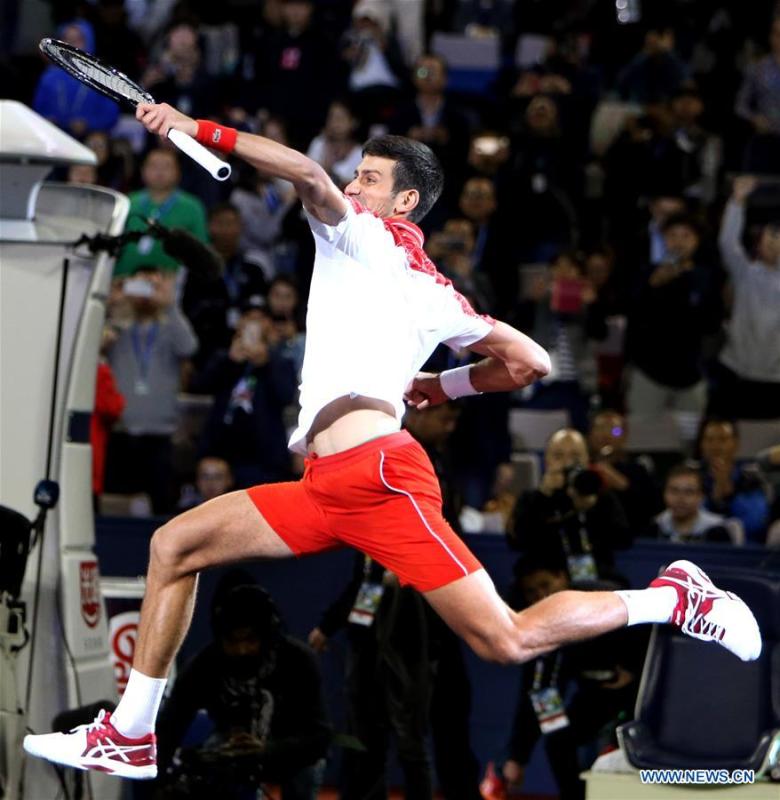 Novak Djokovic of Serbia celebrates after winning the men\'s singles final match against Borna Coric of Croatia at 2018 ATP Shanghai Masters tennis tournament in Shanghai, east China, Oct. 14, 2018. Novak Djokovic won 2-0 in the final and claimed the title of the event. (Xinhua/Fan Jun)