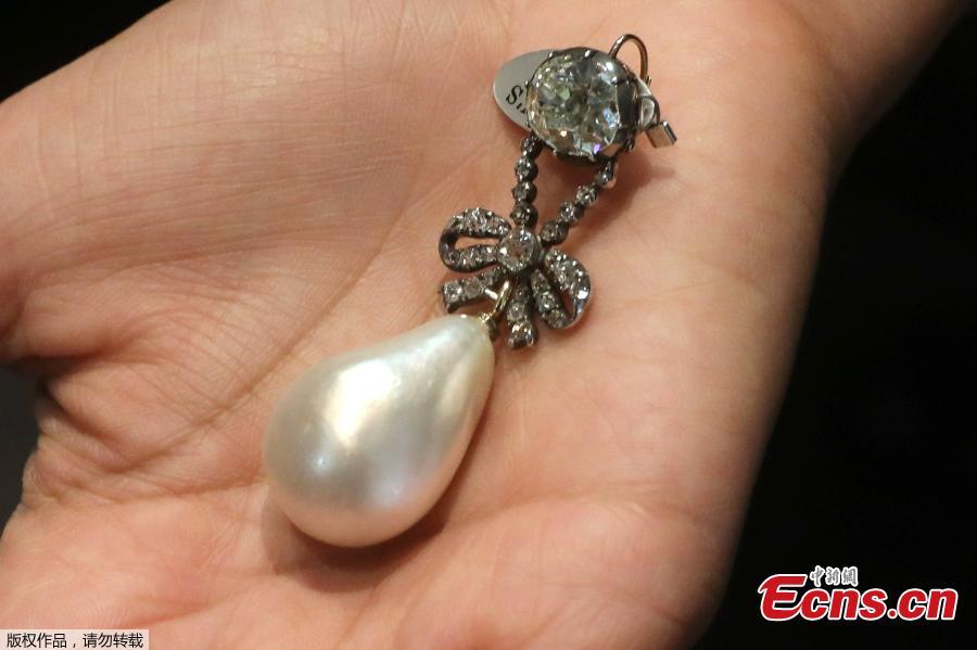 The Queen Marie Antoinette Pearl and diamond pendant, from the 18th century, estimated at $1 million - $2 million, is displayed at Sotheby\'s, in New York, Oct. 12, 2018. It is part of the \