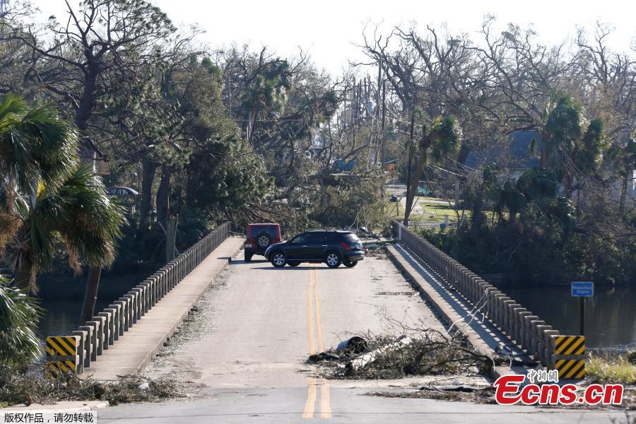 Drivers turn around on a bridge blocked by debris in the aftermath of Hurricane Michael in Panama City, Florida, U.S., October 13, 2018. Dozens of people remained missing on Sunday in Florida Panhandle communities reduced to ruins by Hurricane Michael as rescuers said they expected the death toll to rise and survivors grappled with power outages and shortages of food and water. (Photo/Agencies)