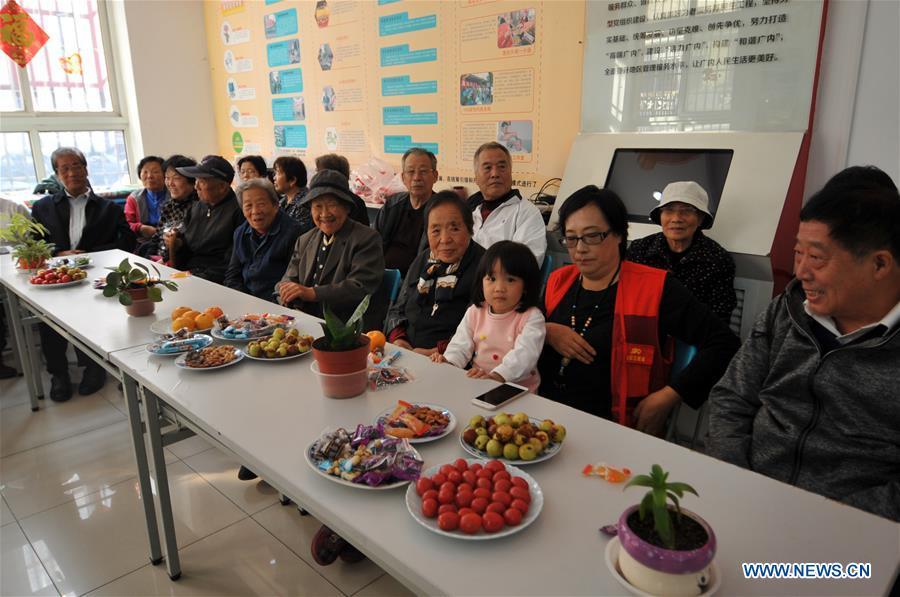 Residents gather in Hetaoyuan community of Xicheng District in Beijing, capital of China, Oct. 16, 2018. Senior residents in the community got together to watch a performance celebrating the upcoming Chongyang Festival, a day to pay respect to seniors that falls on the ninth day of the ninth lunar month, which is on Oct. 17 this year. (Xinhua/Zhao Yusi)