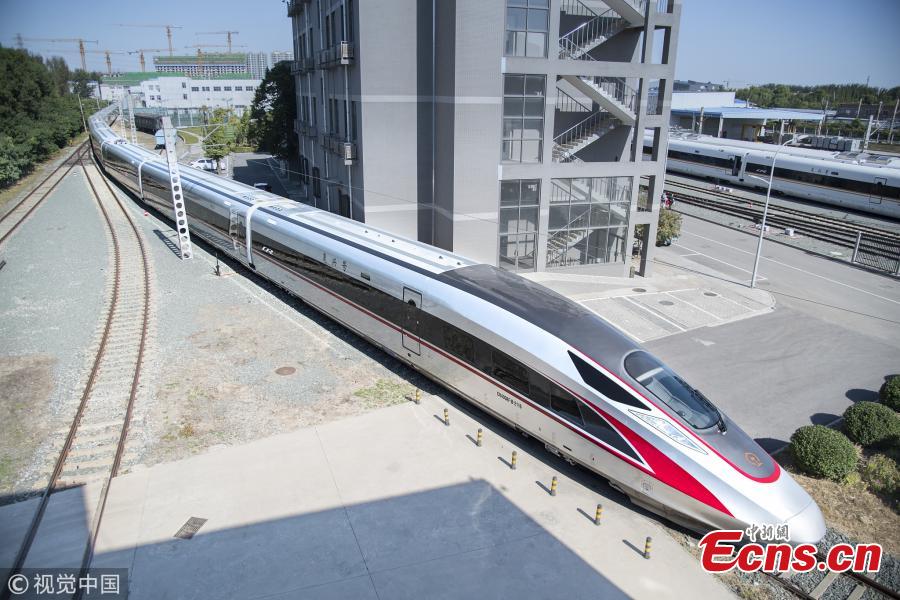 An extended version of the Fuxing bullet train at the China National Railway Test Center in Beijing. With a design speed of 350 kilometers per hour, the new train is 439.8 meters long with 17 carriages, which can carry 1,283 passengers. It will be put into use on the Beijing-Shanghai high-speed railway next year. (Photo/VCG)