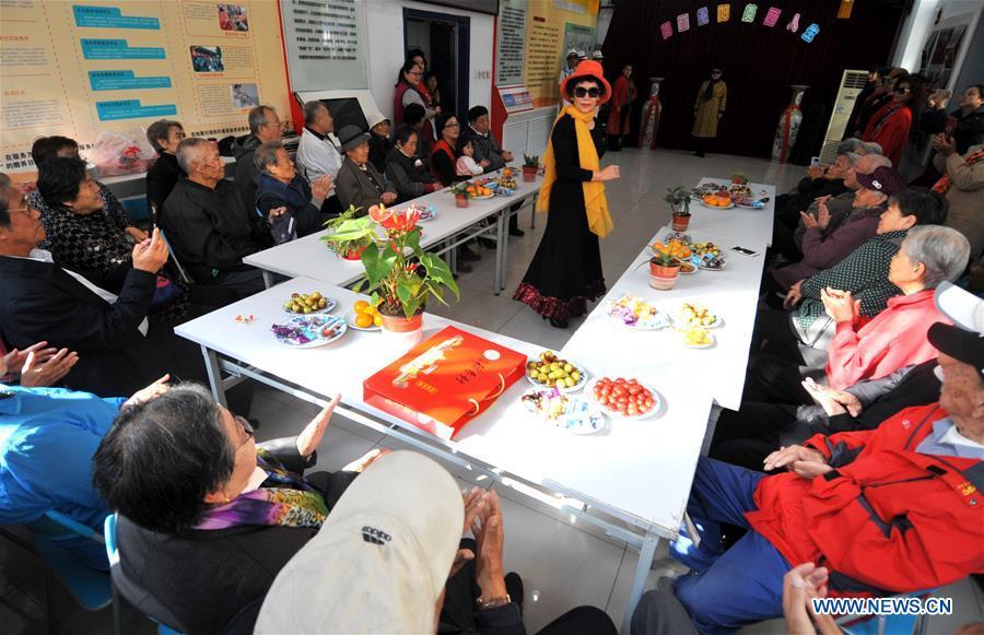 Residents watch a performance in Hetaoyuan community of Xicheng District in Beijing, capital of China, Oct. 16, 2018. Senior residents in the community got together to watch a performance celebrating the upcoming Chongyang Festival, a day to pay respect to seniors that falls on the ninth day of the ninth lunar month, which is on Oct. 17 this year. (Xinhua/Zhao Yusi)