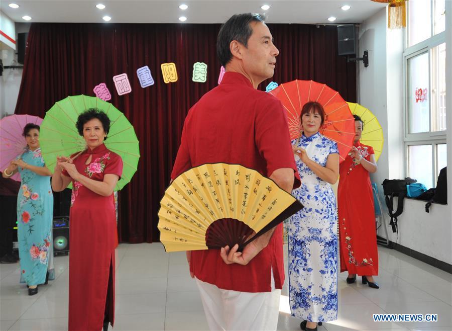 Senior residents perform in Hetaoyuan community of Xicheng District in Beijing, capital of China, Oct. 16, 2018. Senior residents in the community got together to watch a performance celebrating the upcoming Chongyang Festival, a day to pay respect to seniors that falls on the ninth day of the ninth lunar month, which is on Oct. 17 this year. (Xinhua/Zhao Yusi)