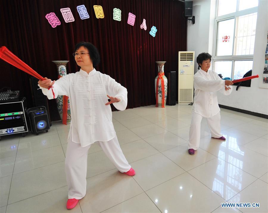 Two senior residents perform Tai Chi in Hetaoyuan community of Xicheng District in Beijing, capital of China, Oct. 16, 2018. Senior residents in the community got together to watch a performance celebrating the upcoming Chongyang Festival, a day to pay respect to seniors that falls on the ninth day of the ninth lunar month, which is on Oct. 17 this year. (Xinhua/Zhao Yusi)