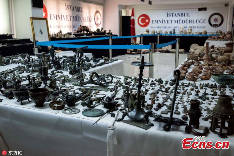 Photo taken on Oct. 19, 2018 shows historical artifacts confiscated in anti-smuggling operations in Istanbul, Turkey. The Istanbul Police Department\'s Anti-Smuggling Crime Branch teams carried out the biggest seizure of historical artifacts in the history of the republic, with raids across 12 Turkish provinces, recovering 14,000 historical pieces and bags full of foreign currency as well as Turkish lira. (Photo/IC)
