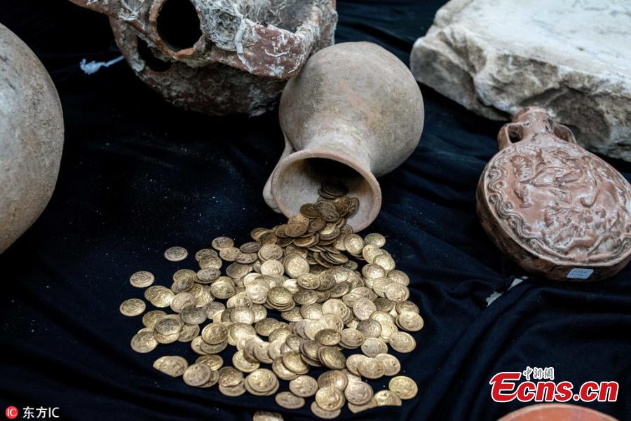 Photo taken on Oct. 19, 2018 shows historical artifacts confiscated in anti-smuggling operations in Istanbul, Turkey. The Istanbul Police Department\'s Anti-Smuggling Crime Branch teams carried out the biggest seizure of historical artifacts in the history of the republic, with raids across 12 Turkish provinces, recovering 14,000 historical pieces and bags full of foreign currency as well as Turkish lira. (Photo/IC)