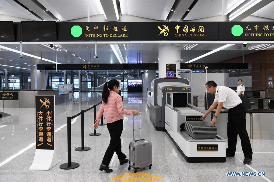 Officials of China Customs rehearse for customs inspection in Zhuhai Port of Hong Kong-Zhuhai-Macao Bridge in Zhuhai, south China\'s Guangdong Province, Oct. 17, 2018. Customs clearance between Macao and Zhuhai will be carried out on a \