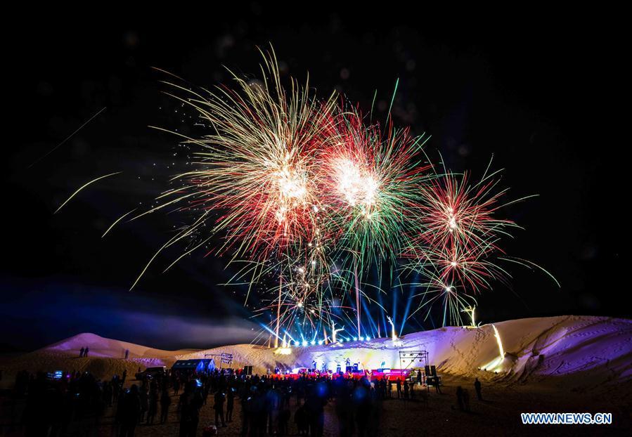 Fireworks are seen during a desert-themed concert held in Qiemo County in the Mongolian Autonomous Prefecture of Bayingolin, northwest China\'s Xinjiang Uygur Autonomous Region, Oct. 20, 2018. (Xinhua/Zhao Ge)