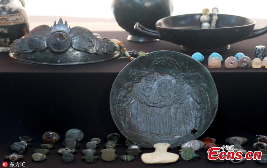 Photo taken on Oct. 19, 2018 shows historical artifacts confiscated in anti-smuggling operations in Istanbul, Turkey. The Istanbul Police Department\'s Anti-Smuggling Crime Branch teams carried out the biggest seizure of historical artifacts in the history of the republic, with raids across 12 Turkish provinces, recovering 14,000 historical pieces and bags full of foreign currency as well as Turkish lira. (Photo/IC)