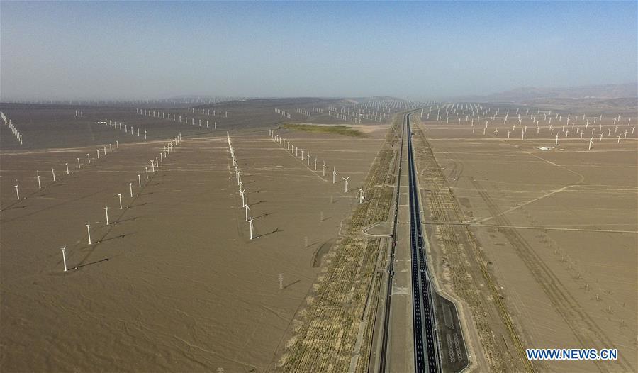 Aerial photo taken on Sept. 22, 2018 shows a wind power plant in Turpan, northwest China\'s Xinjiang Uygur Autonomous Region. Xinjiang has seen a surge in the electricity generation from clean energy. According to State Grid Xinjiang Electric Power Co., Ltd., wind and solar power generated 27.81 billion and 9.07 billion kilowatt hours (kwh) of electricity, respectively, in the first nine months of 2018 in the region. With abundant wind and solar resources, Xinjiang is a pioneer in using new energy in China, with installed new-energy capacity having exceeded 27 million kilowatts so far. (Xinhua/Zhao Ge)
