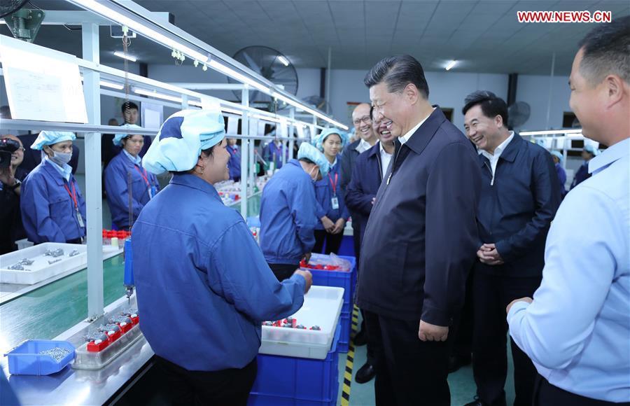 Chinese President Xi Jinping, also general secretary of the Communist Party of China Central Committee and chairman of the Central Military Commission, visits a toy factory in Lianzhang Village, Lianjiangkou Township, Yingde of Qingyuan City, south China\'s Guangdong Province, during an inspection tour, Oct. 23, 2018. (Xinhua/Ju Peng)