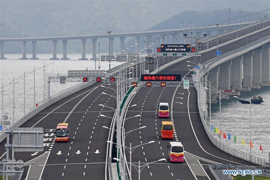 Cars run on the Hong Kong-Zhuhai-Macao Bridge, Oct. 24, 2018. The Hong Kong-Zhuhai-Macao bridge, the world\'s longest cross-sea bridge, opened to public traffic at 9 a.m. Wednesday. (Xinhua/Liang Xu)