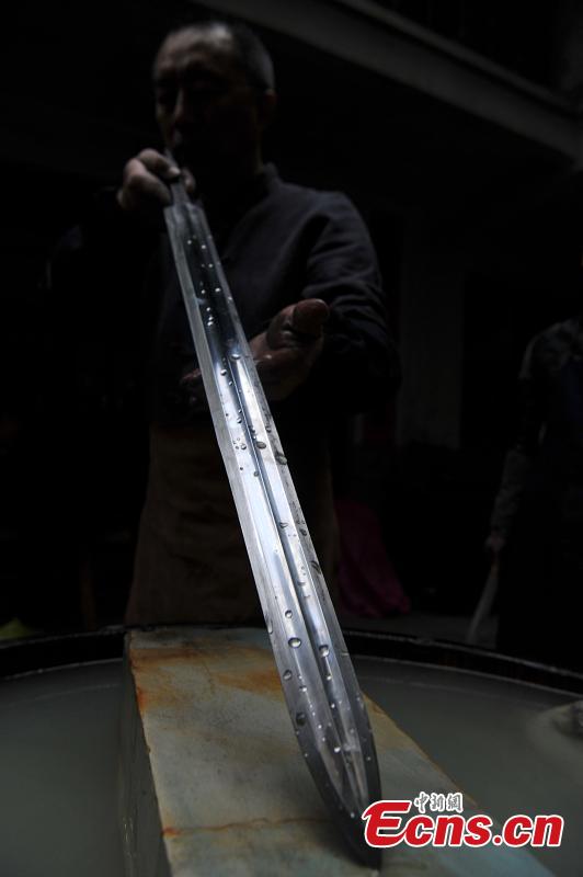 Fan Zhihua and his apprentices make swords in Songxi County, East China’s Fujian Province. Zhanlu Mountain in southern Songxi, well-known for its long history and strong culture, is said to have been the home to the most revered among top five most famous swords in ancient China. Chinese poets in the Tang and Song dynasties, including Du Fu, Li Bai and Su Shi, penned lines in praise of the Zhanlu swords, nicknamed as the “No. 1 Sword Under the Heaven”. In 1985, local craftsmen went to huge efforts, reading historical literature and working with research institutes in Beijing and Nanjing, to finally craft Zhanlu swords by hand again. Making a Zhanlu sword involves more than 100 time-consuming steps, including forging, quenching and grinding. (Photo: China News Service/Zhang Bin)
