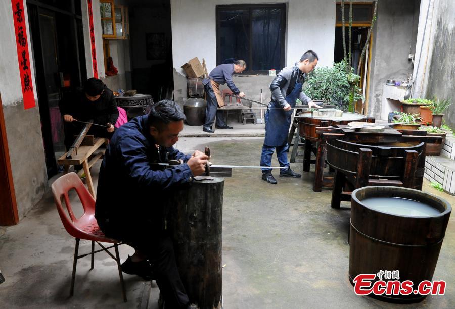Fan Zhihua and his apprentices make swords in Songxi County, East China’s Fujian Province. Zhanlu Mountain in southern Songxi, well-known for its long history and strong culture, is said to have been the home to the most revered among top five most famous swords in ancient China. Chinese poets in the Tang and Song dynasties, including Du Fu, Li Bai and Su Shi, penned lines in praise of the Zhanlu swords, nicknamed as the “No. 1 Sword Under the Heaven”. In 1985, local craftsmen went to huge efforts, reading historical literature and working with research institutes in Beijing and Nanjing, to finally craft Zhanlu swords by hand again. Making a Zhanlu sword involves more than 100 time-consuming steps, including forging, quenching and grinding. (Photo: China News Service/Zhang Bin)