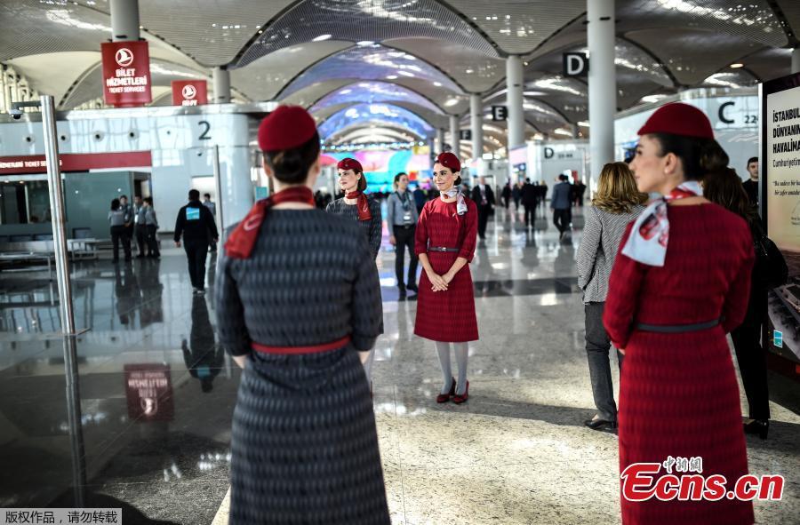 Turkish Airlines stewardesses pose at a terminal of the Istanbul\'s new airport prior to the official opening ceremony, in Istanbul, Turkey, Oct. 29, 2018. (Photo/Agencies)